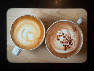 latte coffee cup and Mocha coffee cup on wood tray