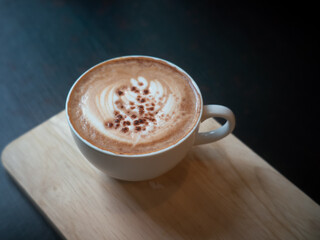 Mocha coffee cup on wood tray