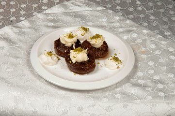 Fig dessert with ice cream in a porcelain plate.