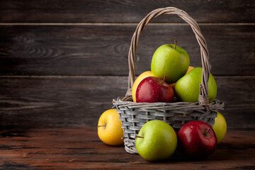 Colorful ripe apple fruits in basket