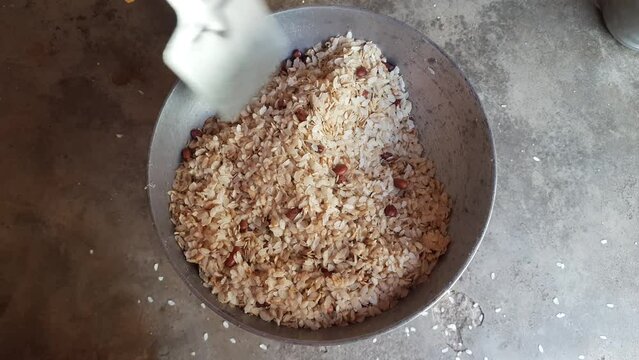 Pohaa and peanut frying in pan. In India, it is eaten with great fervor with tea in the evening. Its other names &nbsp;pauwa,&nbsp;sira,&nbsp;chira, or&nbsp;avalakki.&nbsp;Traditional snacks of India.