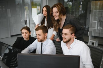 Group of businessmen and businesswomen stock brokers working at office.