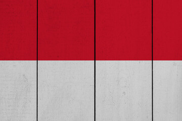 Patriotic wooden plank background in colors of flag. Monaco