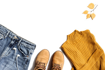 Autumn warm clothes flat lay, fashion red shoes, knitted sweater or turtleneck, blue jeans isolated on white. Women cozy wear