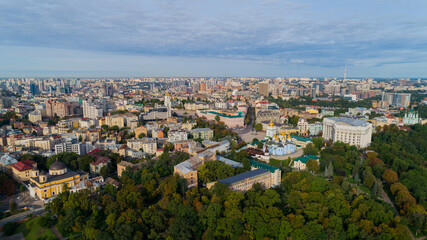 Fototapeta na wymiar Aerial view beautiful Kyiv cityscape on a sunny spring day. Drone shot Kiev building. Capital of Ukraine 