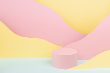 Circle pink podium mockup with abstract mountain landscape - colorful pastel pink, yellow, mint color slopes in baby cartoon naive style. Template for presentation of cosmetic, advertising, showing.