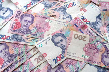 top view about a lot of Ukrainian hryvnia on the table.