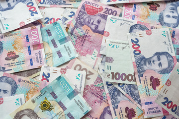 a large amount of bribes in Ukrainian currency is on the table after their withdrawal.