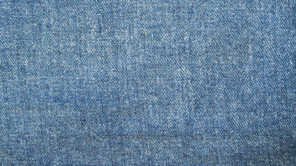 Fototapeta na wymiar Blue jeans fabric background texture. Close up view.