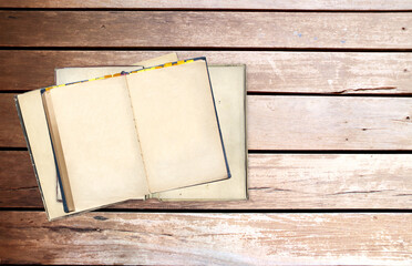 Old open books with empty pages on wooden boards. Opened vintage book with blank page on wood plank