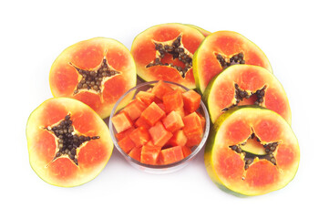 Many sliced of red papaya fruit in glass bowl and isolated on white background.	