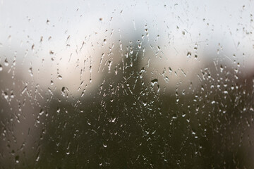 Large raindrops on the window glass, weather, rain, forecast, rainy window background