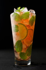 Alcoholic cocktail with lime and mint and ice, cool alcohol, bar, cocktail party