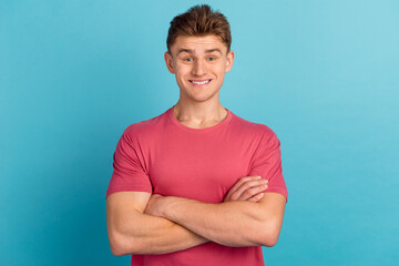 Photo of young handsome man crossed hands confident intelligent promoter isolated over blue color...