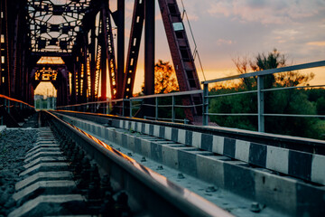 View of big steel railway bridge on sunrise.