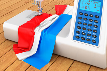 Sewing machine with Luxembourgish flag on the wooden table. 3D rendering