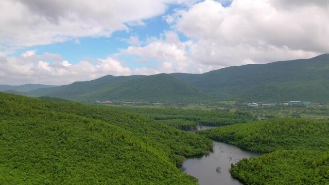 Aerial time lapse landscape with green hills, river and forest, timelapse or hyperlapse concept