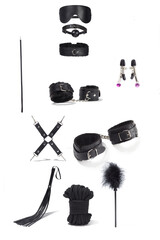 Detailed shot of a black set of erotic accessories. The handcuffs, shackles, a gag, a mask, a rope,...