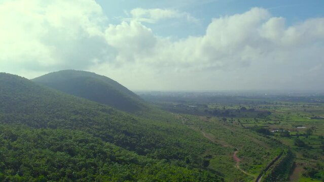 Aerial landscape with green hills and forest