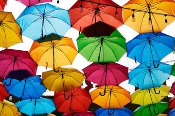 Fototapeta na wymiar Colorful umbrellas used as a decoration over a walkway