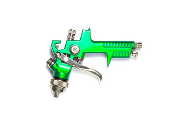 industrial green airbrush on a white background close-up. paint spray tool