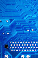 Close-up of a printed blue computer circuit board