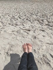 feet in beach sand