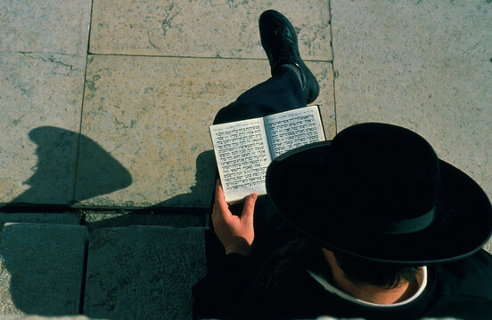 Orthodox Jew reading at the Kotel, also called Western Wall or wailing wall..