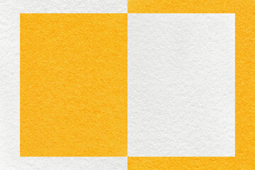 Texture of white and bright yellow paper background with geometric shape and pattern, macro. Craft orange cardboard