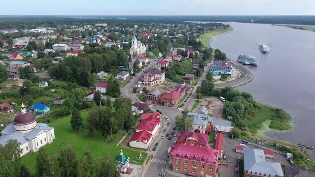 Aerial panoramic view of Russian town of Myshkin on banks of Volga River on summer day overlooking Assumption Cathedral and Nikolskaya church, Yaroslavl Oblast