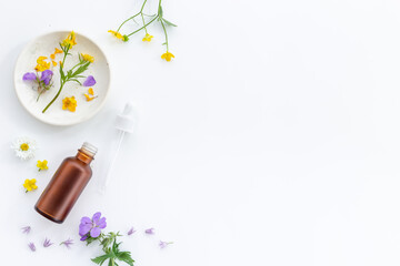 Cosmetic bottle with pipette and medicinal herbs essential oil