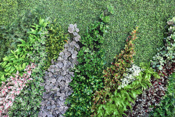 Wall decorated with artificial plants.