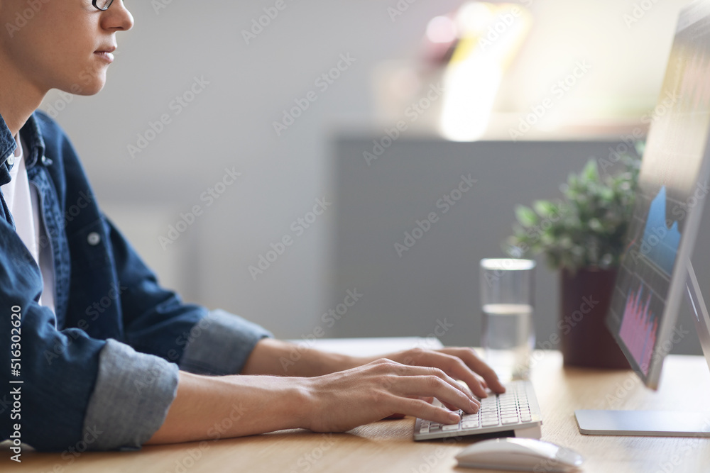 Aufkleber young man trading online, checking financial statistics while working on computer