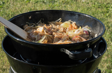 coocking outdoor on a gas stove on a camping