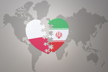 puzzle heart with the national flag of iran and poland on a world map background.Concept.