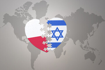 puzzle heart with the national flag of israel and poland on a world map background.Concept.