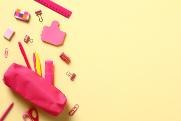 Back to school concept. Flat lay pink school supplies and pencil box on yellow background. - obrazy, fototapety, plakaty