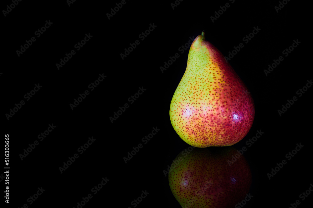 Wall mural yellow red pear on blue background with reflection - Wall murals