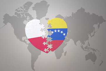puzzle heart with the national flag of venezuela and poland on a world map background.Concept.