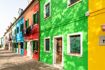Fototapeta na wymiar Street with colorful houses on the island of Burano . Italy.