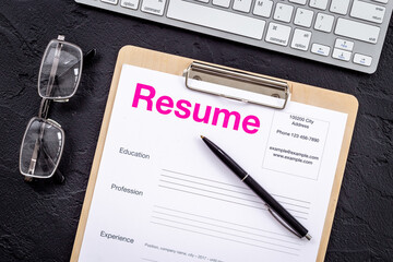 Searhing for a new job. Resume application form on office table