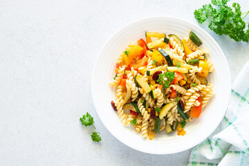 Vegan pasta fusilli with vegetables, zucchini, paprika and grean beans. Meatless vegetarian menu....