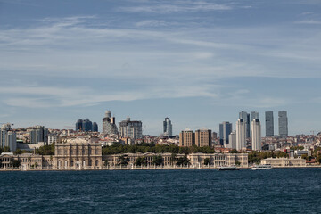 Fototapeta premium View of historical Dolmabahce Palace by Bosphorus and European side of Istanbul. It is a sunny summer day.