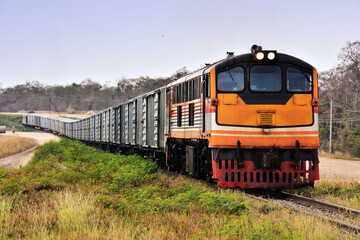 Obraz premium Freight train by diesel locomotive on the railway in Thailand