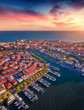 Evening in Grado port, small town located between Venice and Trieste. Fantastic sunset on Adriatic coast, Italy, Europe. Traveling concept background.