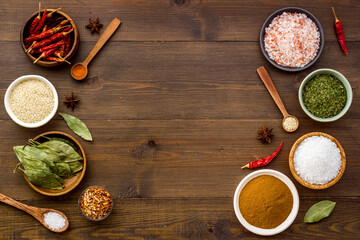 Assortment of cooking flavor - spices and herbs in bowls, top view