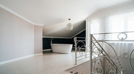 White bathroom in modern house stands in master bedroom.