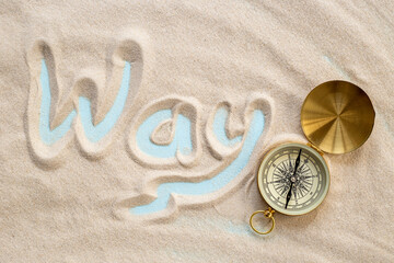 Fototapeta na wymiar Compass in the sand. Business navigates recovery concept
