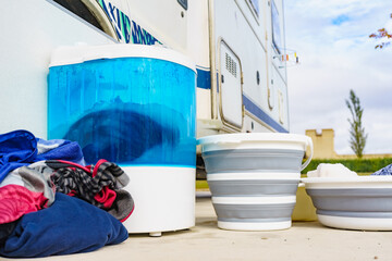 Washing laundry outdoor at caravan