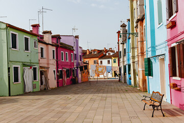 Fototapeta na wymiar Street with colorful houses on the island of Burano in the morning. Italy.